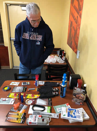 Santa Joe makes sure the present table is ready for guests